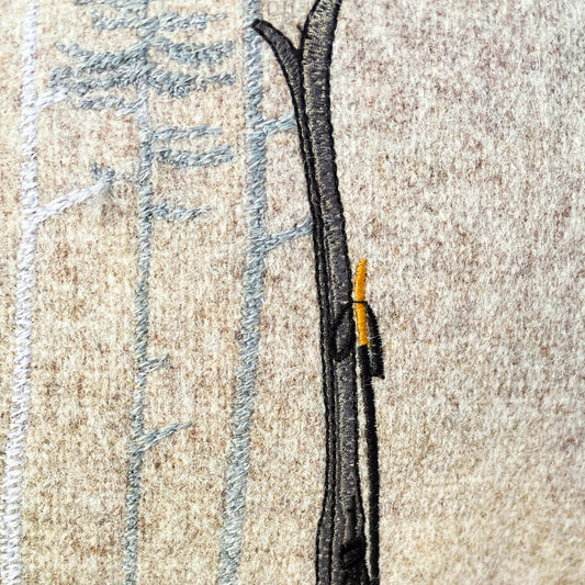 Melange wool cushion with fir embroidery