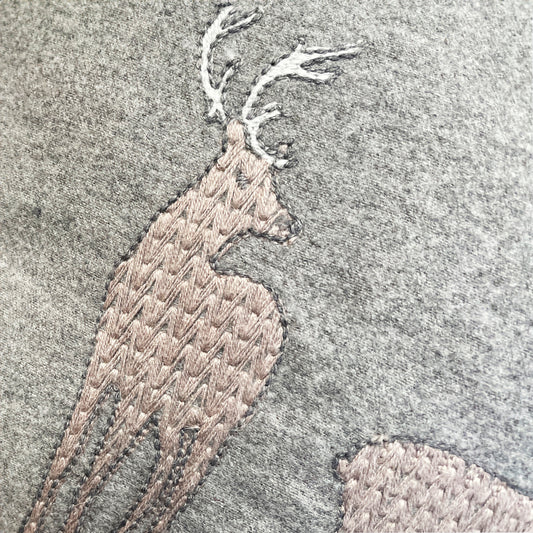 Melange wool cushion with fir embroidery