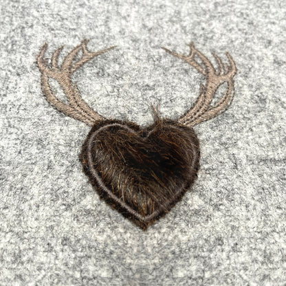 Melange wool cushion with fir embroidery