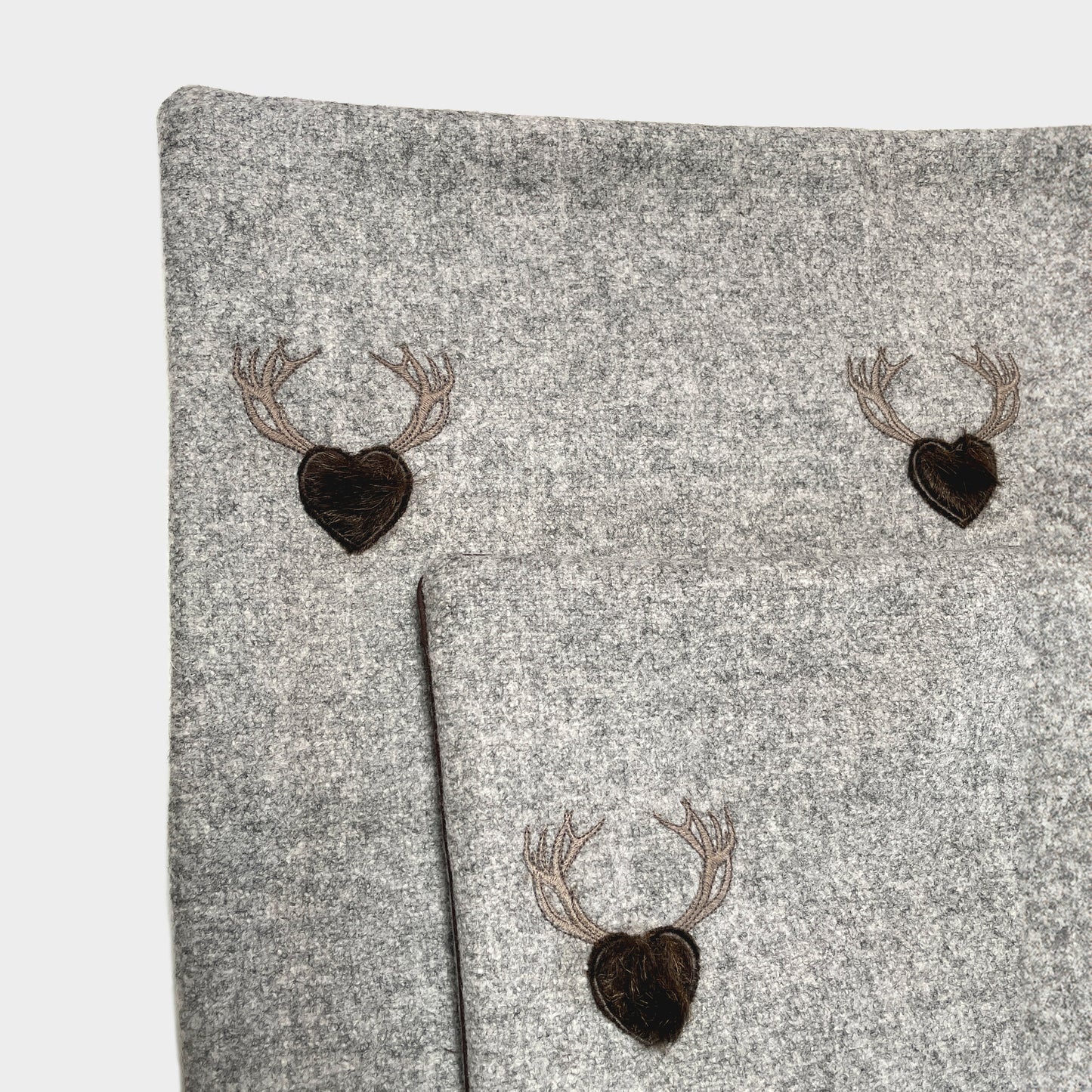Melange wool cushion with fir embroidery