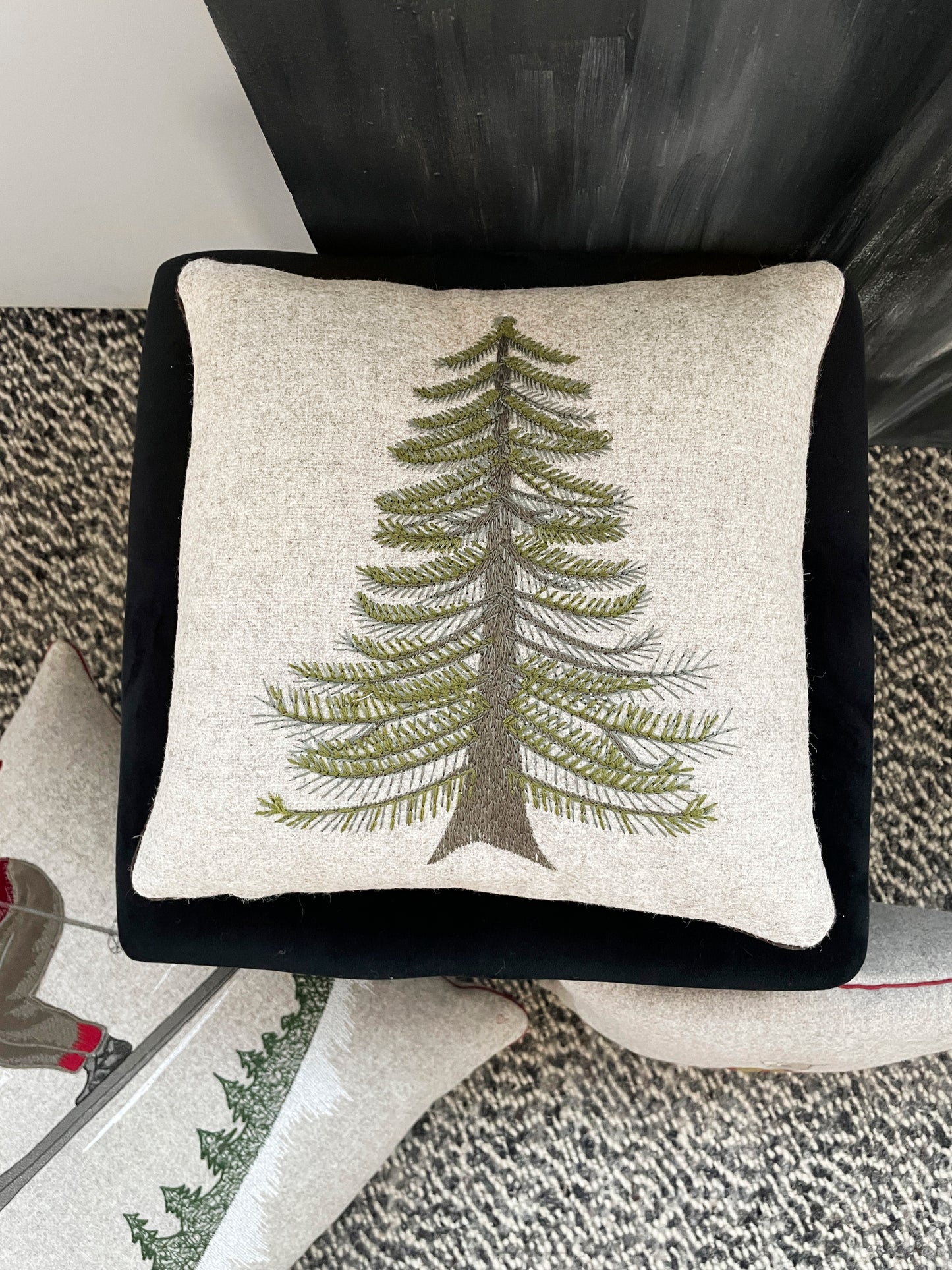 Melange wool cushion with fir embroidery